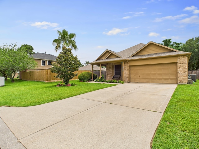 1035 Turnberry Park Ln, Spring, TX 77373 - single story home featuring an attached garage, concrete driveway, brick siding, central AC unit, and roof with shingles