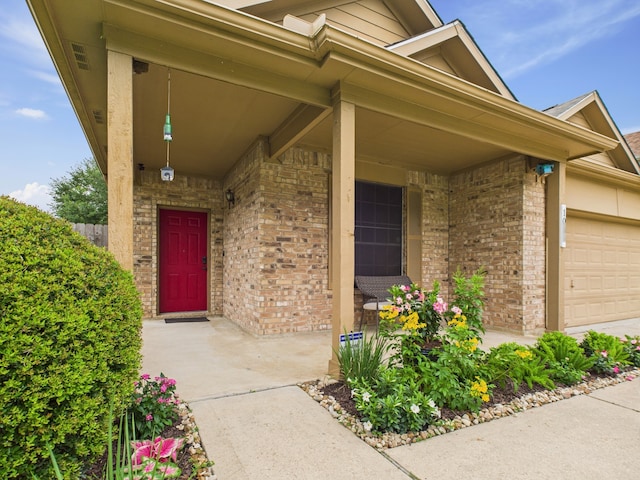 1035 Turnberry Park Ln, Spring, TX 77373 - entrance to property with brick siding, a garage, and covered porch
