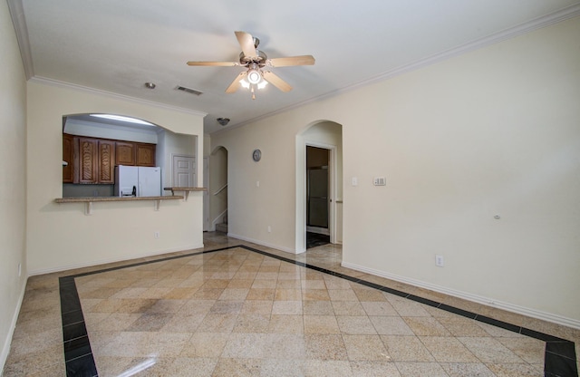 9400 Bellaire Blvd Unit 112, Houston, TX 77036 - unfurnished living room with inlaid floor details, arched walkways, a ceiling fan, baseboards, and crown molding