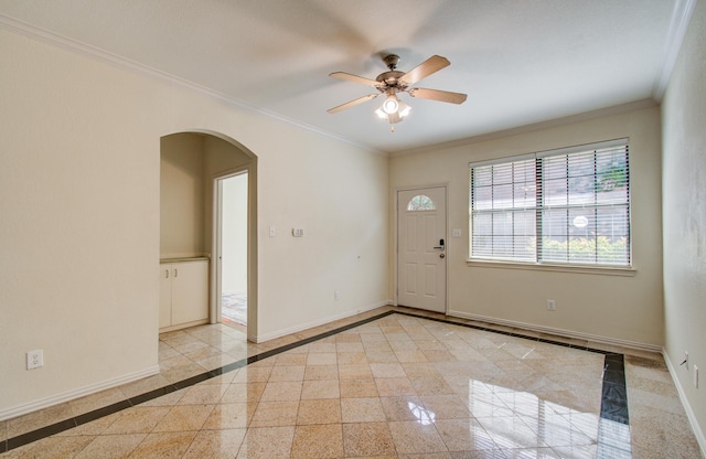 9400 Bellaire Blvd Unit 112, Houston, TX 77036 - entrance foyer featuring arched walkways, a ceiling fan, baseboards, crown molding, and inlaid floor details