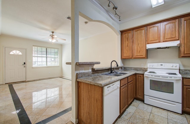 9400 Bellaire Blvd Unit 112, Houston, TX 77036 - kitchen with white appliances, under cabinet range hood, a sink, crown molding, and brown cabinetry