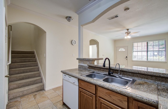 9400 Bellaire Blvd Unit 112, Houston, TX 77036 - kitchen with white dishwasher, a sink, ornamental molding, ceiling fan, and baseboards