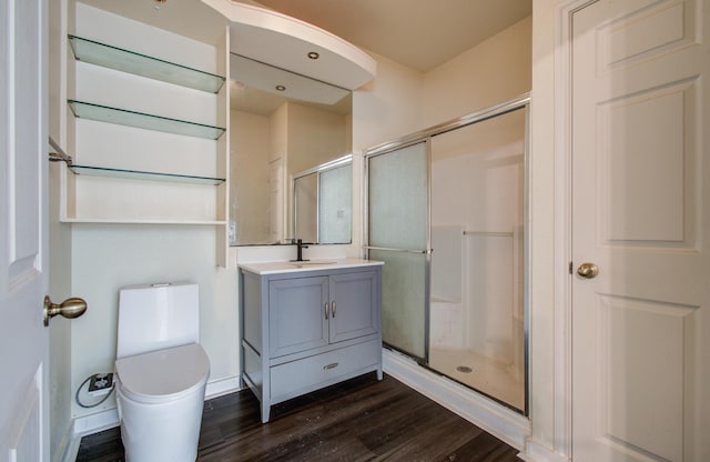 9400 Bellaire Blvd Unit 112, Houston, TX 77036 - bathroom with wood finished floors, toilet, a stall shower, and vanity