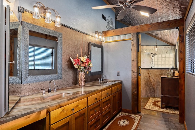 22 Indian Creek Loop, Kerrville, TX 78028 - bathroom featuring a shower stall, double vanity, a ceiling fan, and vaulted ceiling