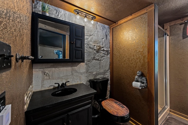 22 Indian Creek Loop, Kerrville, TX 78028 - bathroom with a textured ceiling, a stall shower, and vanity