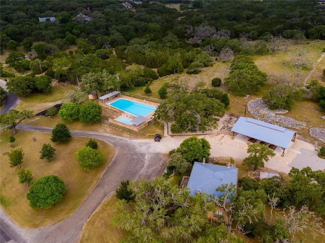 22 Indian Creek Loop, Kerrville, TX 78028 - bird's eye view of a pool area and a heavily wooded area