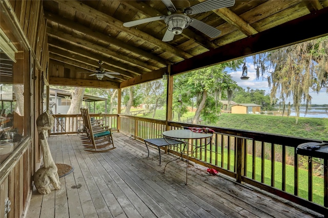 30523 Plantation Dr Unit 37, Damon, TX 77486 - wooden terrace with ceiling fan and a lawn