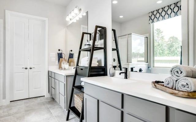 2227 Inglenook Grove Dr, Katy, TX 77493 - bathroom with plenty of natural light, vanity, recessed lighting, and a shower with door
