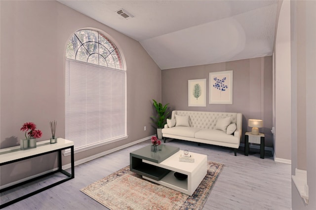 3626 Liles Ln, Humble, TX 77396 - living room featuring wood finished floors, baseboards, and vaulted ceiling