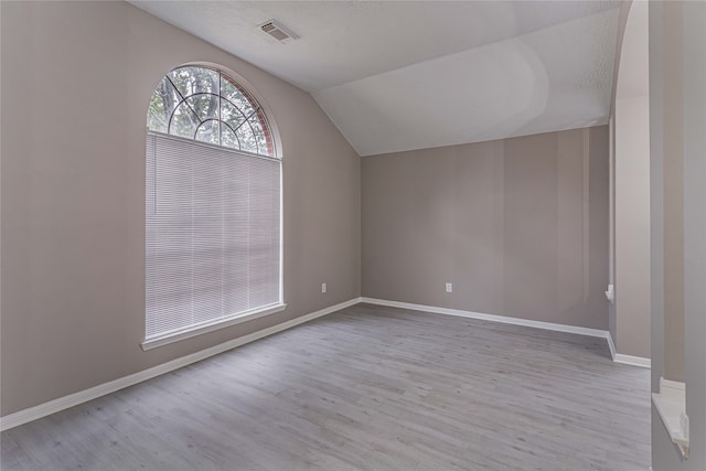 3626 Liles Ln, Humble, TX 77396 - additional living space with vaulted ceiling, wood finished floors, and baseboards
