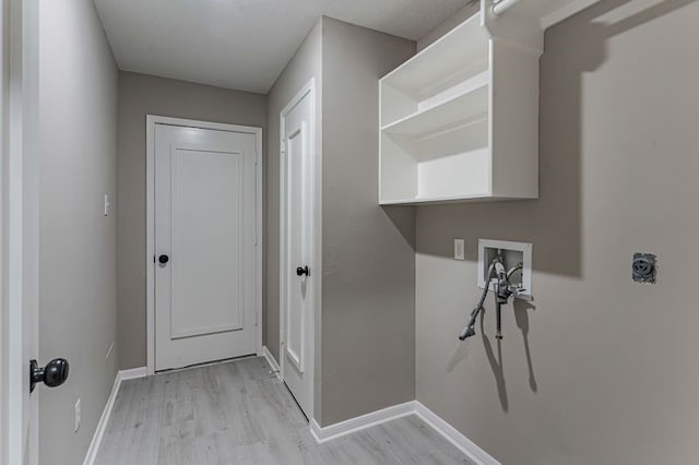 3626 Liles Ln, Humble, TX 77396 - laundry area featuring hookup for a washing machine, electric dryer hookup, light wood-style floors, and baseboards