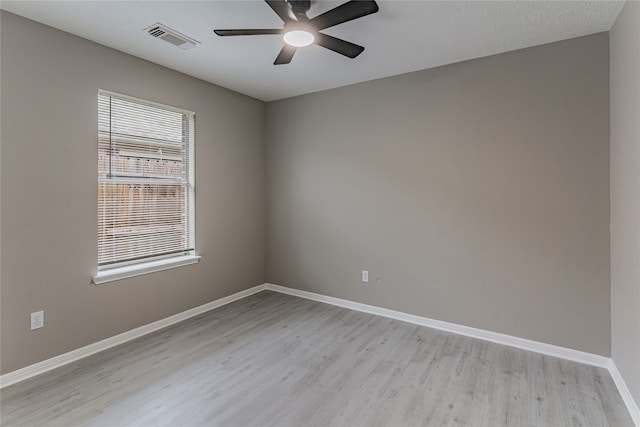 3626 Liles Ln, Humble, TX 77396 - unfurnished room with light wood-type flooring, a ceiling fan, and baseboards