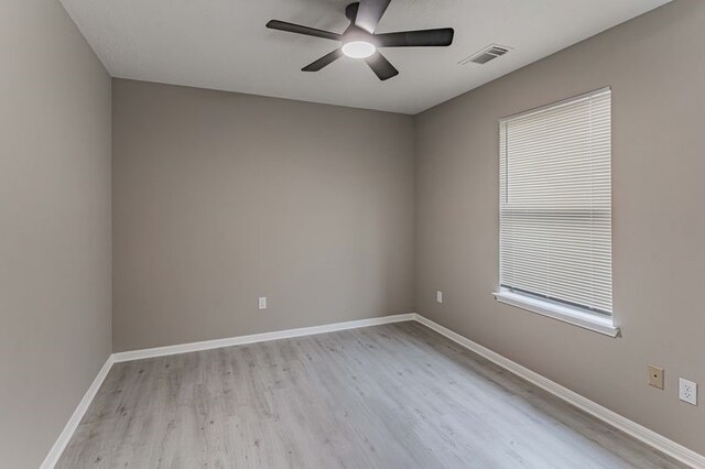 3626 Liles Ln, Humble, TX 77396 - unfurnished room with light wood-type flooring, a ceiling fan, and baseboards