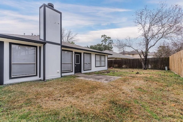 3626 Liles Ln, Humble, TX 77396 - rear view of property with a chimney and a patio area