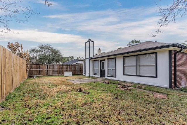 3626 Liles Ln, Humble, TX 77396 - back of property with a chimney, brick siding, and a patio area