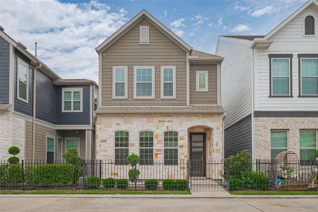 2022 Tarfite Pl, Houston, TX 77077 - multi unit property featuring stone siding and a fenced front yard