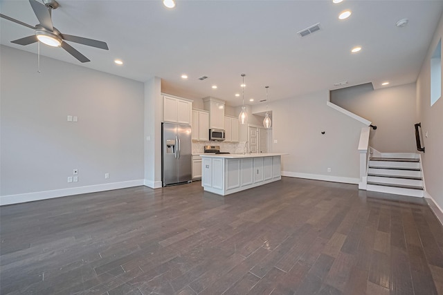 2022 Tarfite Pl, Houston, TX 77077 - kitchen featuring stainless steel appliances, open floor plan, baseboards, light countertops, and recessed lighting
