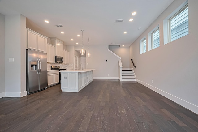 2022 Tarfite Pl, Houston, TX 77077 - kitchen with stainless steel appliances, decorative backsplash, dark wood-style flooring, a sink, and recessed lighting