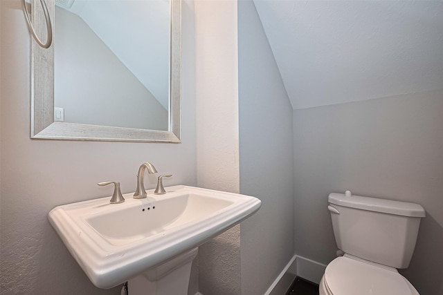 2022 Tarfite Pl, Houston, TX 77077 - bathroom with lofted ceiling, a sink, and toilet