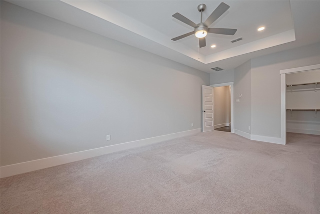 2022 Tarfite Pl, Houston, TX 77077 - unfurnished bedroom with recessed lighting, light carpet, baseboards, a raised ceiling, and a spacious closet