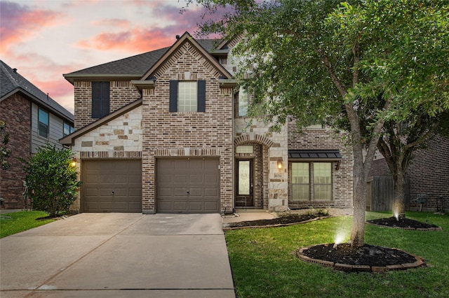16714 Radiant Lilac Trl, Cypress, TX 77433 - view of front facade with concrete driveway, a lawn, brick siding, stone siding, and a garage