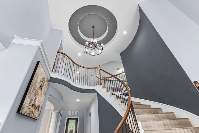 16714 Radiant Lilac Trl, Cypress, TX 77433 - stairway with a towering ceiling, a raised ceiling, a chandelier, and recessed lighting