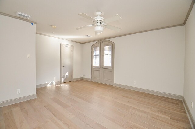 6 River Hollow Ln, Houston, TX 77027 - spare room with ceiling fan, crown molding, light wood-type flooring, and baseboards