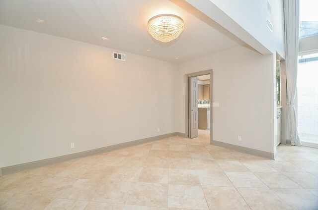 6 River Hollow Ln, Houston, TX 77027 - unfurnished room with a chandelier, recessed lighting, and baseboards