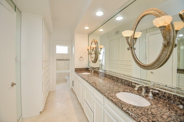 6 River Hollow Ln, Houston, TX 77027 - bathroom with recessed lighting, toilet, double vanity, and tile patterned floors