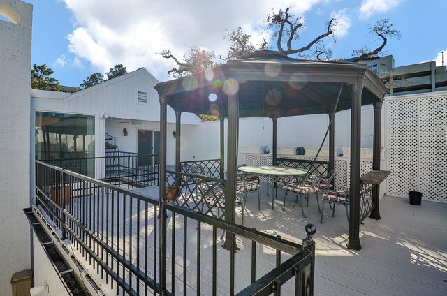 6 River Hollow Ln, Houston, TX 77027 - view of patio with a gazebo, outdoor dining area, and a deck