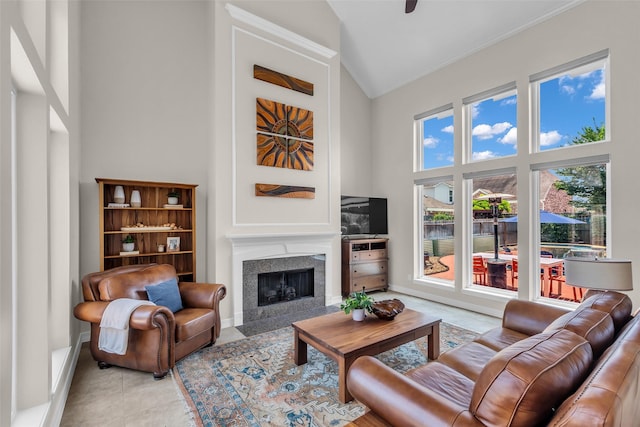 25607 Ryans Creek Ct, Katy, TX 77494 - living area featuring high vaulted ceiling, a fireplace with flush hearth, plenty of natural light, baseboards, and light tile patterned floors