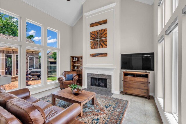 25607 Ryans Creek Ct, Katy, TX 77494 - living room featuring high vaulted ceiling, plenty of natural light, a high end fireplace, ornamental molding, and baseboards