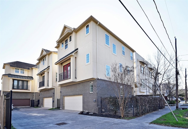 5525 Petty St Unit A, Houston, TX 77007 - view of building exterior featuring a garage and driveway