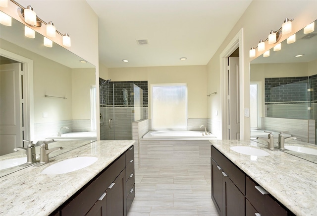 5525 Petty St Unit A, Houston, TX 77007 - full bath with two vanities, a garden tub, and a shower stall