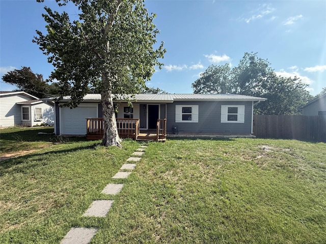 445 W Vaughan St, Bertram, TX 78605 - view of front of house with an attached garage and metal roof