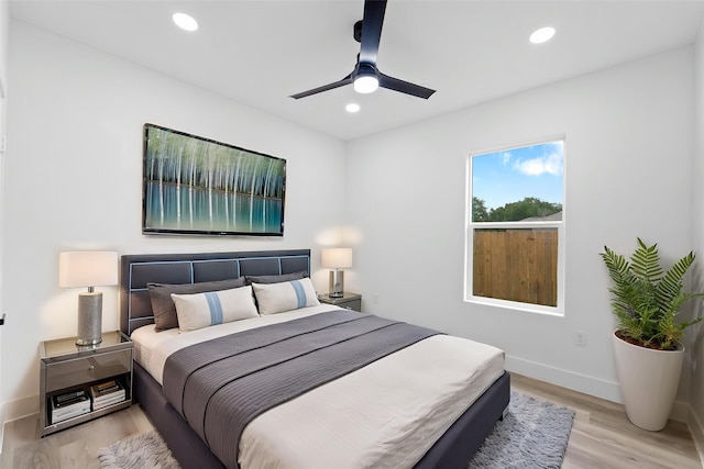 821 Empire St, El Campo, TX 77437 - bedroom featuring light wood-style flooring, recessed lighting, baseboards, and ceiling fan