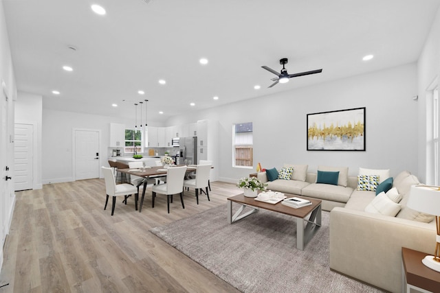821 Empire St, El Campo, TX 77437 - living area featuring recessed lighting, light wood-type flooring, a ceiling fan, and baseboards
