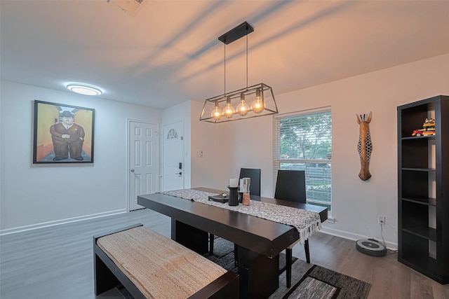 12602 Westleigh Dr, Houston, TX 77077 - dining space featuring dark wood-type flooring, baseboards, and an office area
