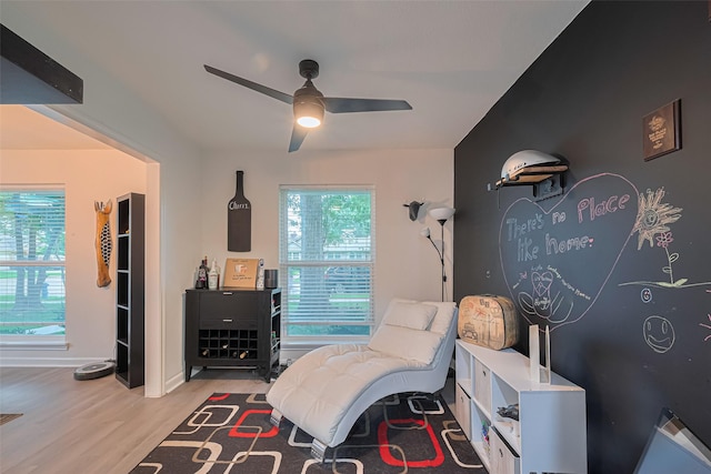 12602 Westleigh Dr, Houston, TX 77077 - living area with a ceiling fan, wood finished floors, and baseboards