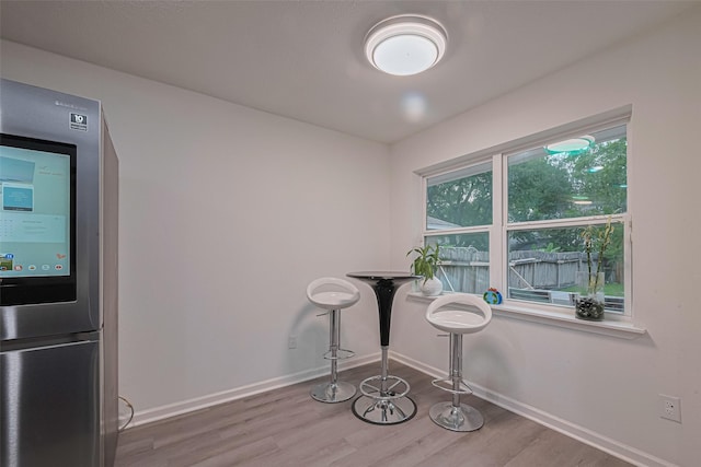 12602 Westleigh Dr, Houston, TX 77077 - unfurnished dining area featuring wood finished floors and baseboards