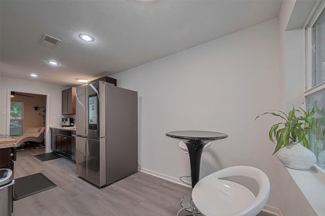 12602 Westleigh Dr, Houston, TX 77077 - kitchen featuring smart refrigerator, light wood-style flooring, light countertops, dark brown cabinetry, and recessed lighting