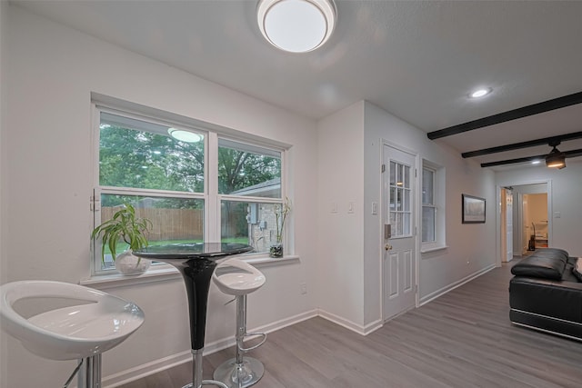 12602 Westleigh Dr, Houston, TX 77077 - dining area with wood finished floors, baseboards, and beam ceiling