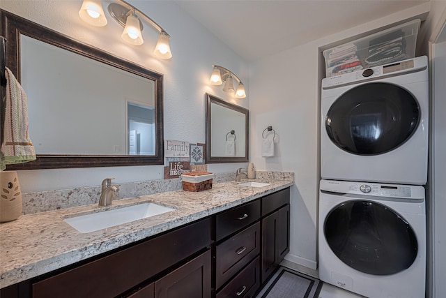 12602 Westleigh Dr, Houston, TX 77077 - full bathroom with stacked washer and clothes dryer, double vanity, and tile patterned flooring