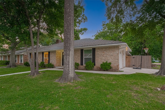 12602 Westleigh Dr, Houston, TX 77077 - view of front of property with a garage, brick siding, a front yard, a chimney, and concrete driveway