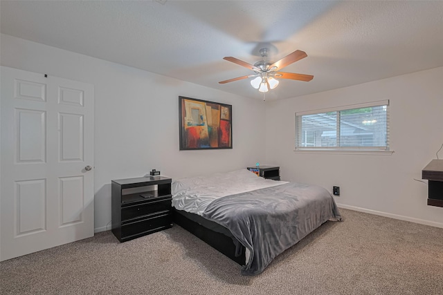 12602 Westleigh Dr, Houston, TX 77077 - bedroom with light colored carpet, baseboards, and ceiling fan