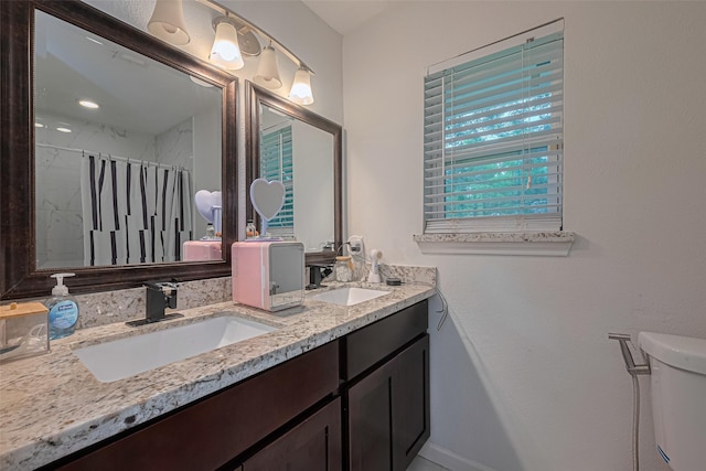 12602 Westleigh Dr, Houston, TX 77077 - bathroom with toilet, double vanity, and curtained shower