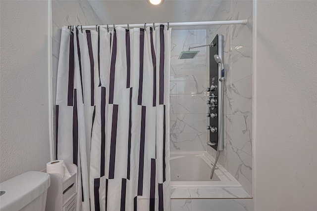 12602 Westleigh Dr, Houston, TX 77077 - bathroom featuring shower / bathtub combination with curtain, toilet, marble look tile flooring, and a textured wall