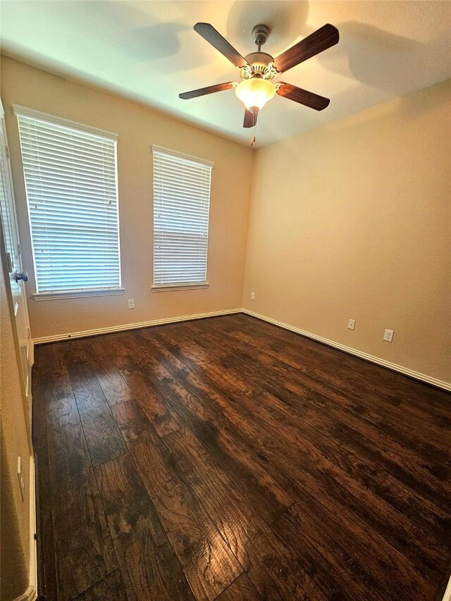 23122 Biddle Dr, Porter, TX 77365 - spare room with dark wood-style floors, ceiling fan, and baseboards