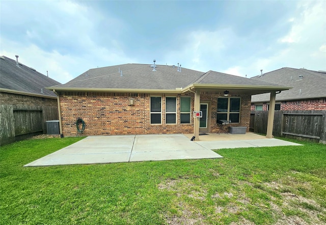 23122 Biddle Dr, Porter, TX 77365 - rear view of property with a patio area, brick siding, central air condition unit, and a shingled roof