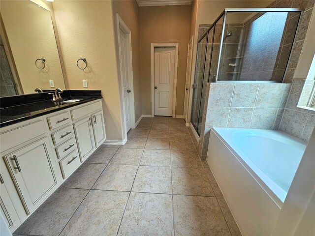 23122 Biddle Dr, Porter, TX 77365 - bathroom featuring vanity, a shower stall, a bath, baseboards, and tile patterned floors
